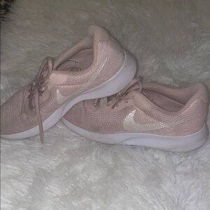 Nike Pink and White Sneakers with Minimalist Design